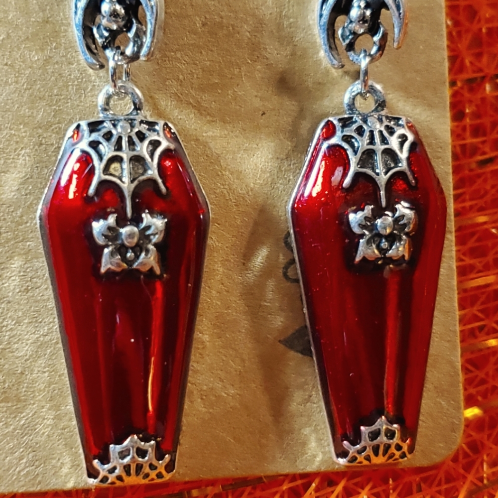 Gorgeous Vampire Coffins. Adorned with spiderwebs and roses. #Halloween #Spooky